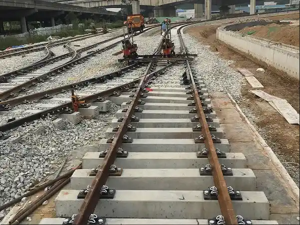 Dedicated Vibration-Damping Fastening System for Railway Turnouts