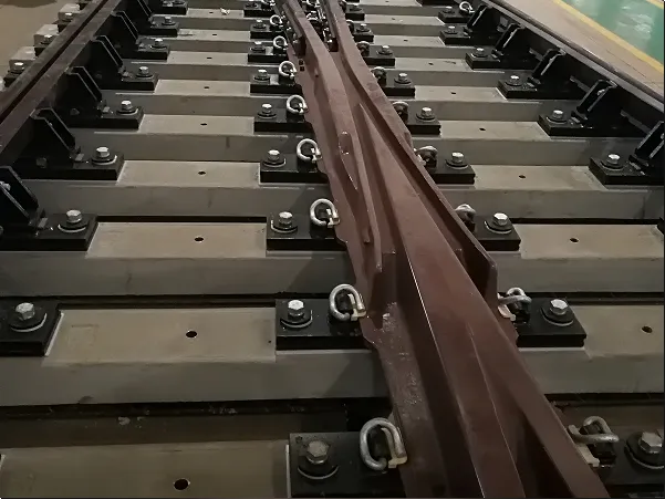 Dedicated Vibration-Damping Fastening System for Railway Turnouts